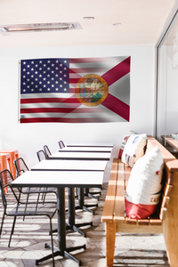 a room with a long table and a flag hanging on the wall