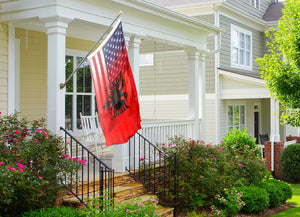 an american Albanian flag hybrid on a porch of a house