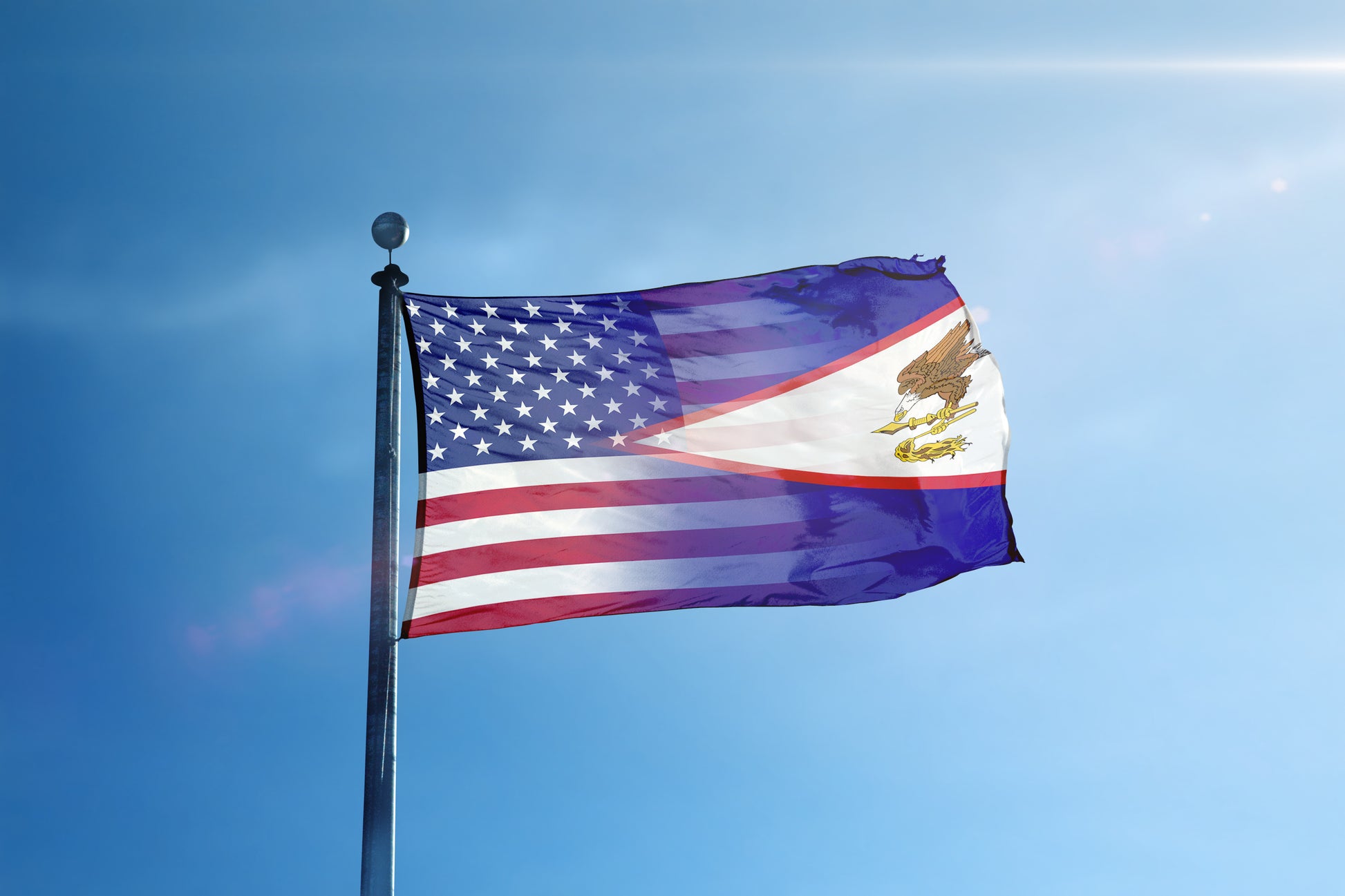 a flag flying in the wind on a sunny day