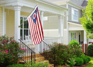 an american flag on a porch of a house