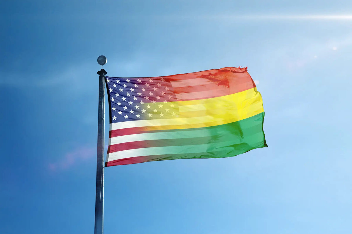 Bolivian American Hybrid Flag house flag on a flagpole; blue star field with rainbow stripes fluttering in the wind.