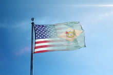 Load image into Gallery viewer, the flag of the state of new york flies high in the blue sky

