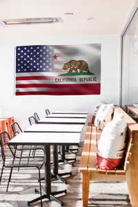 a long table with chairs and a flag hanging on the wall