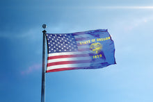 Load image into Gallery viewer, a state of oregon flag flying in the wind
